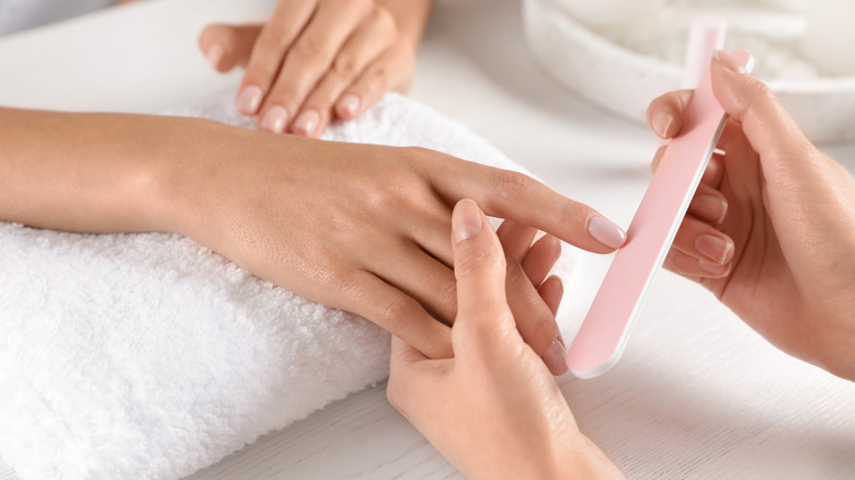 manicurist at table