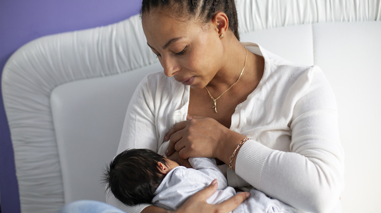 woman breastfeeding her baby