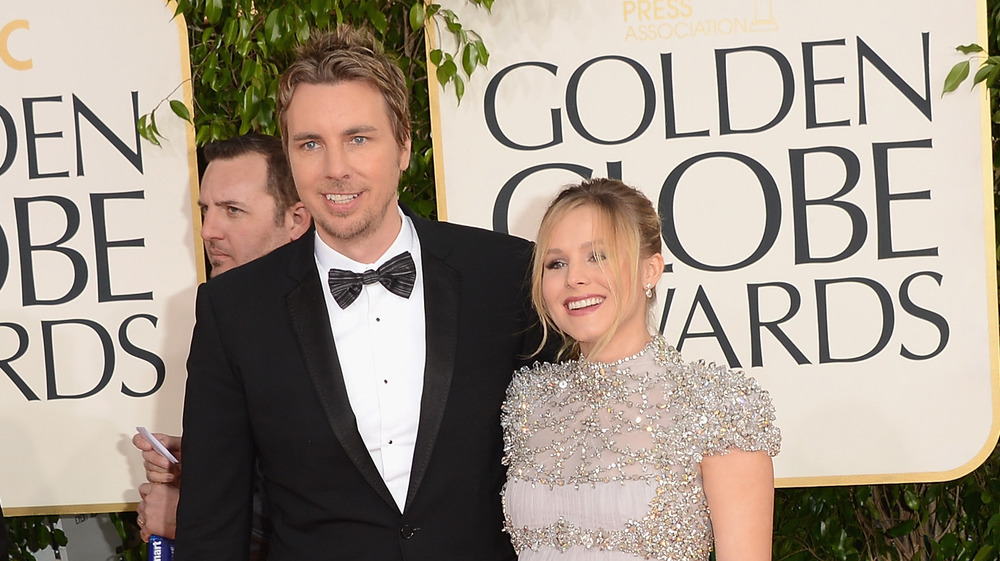 Close up image of Kristen Bell and husband Dax Shepard together at a premier