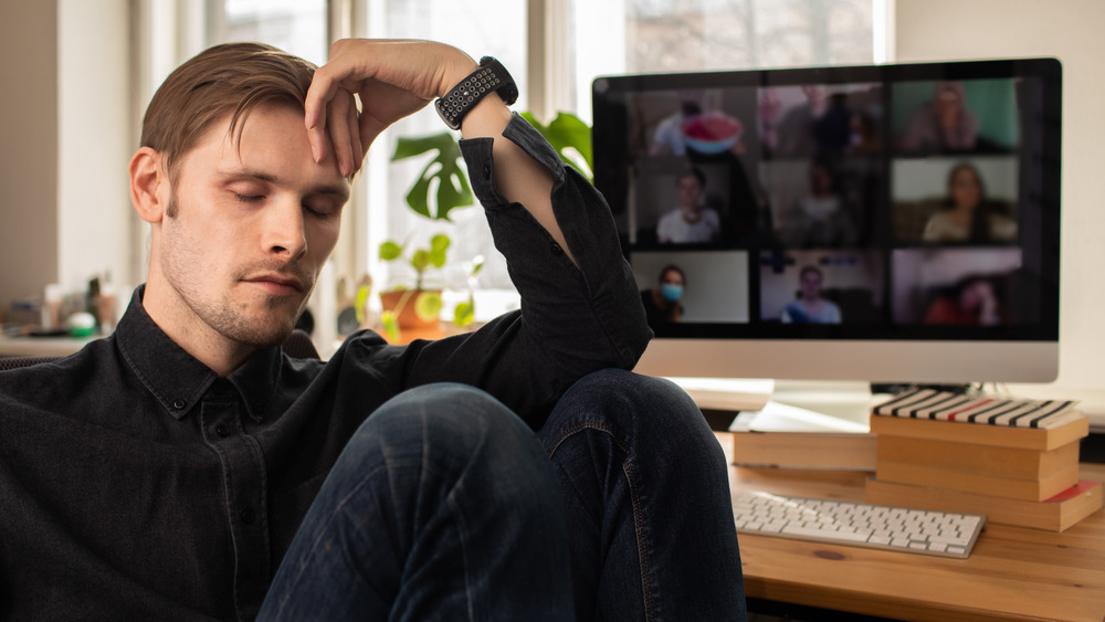 Man in front of teleconference 