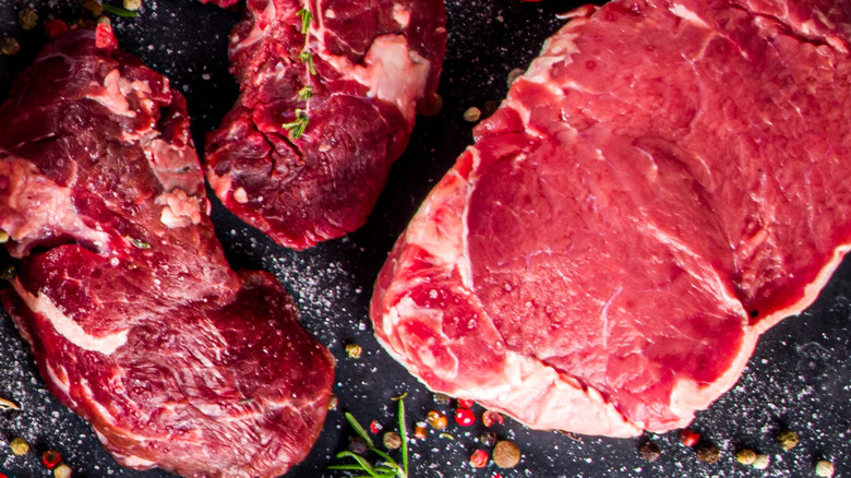 Raw meat on a black background