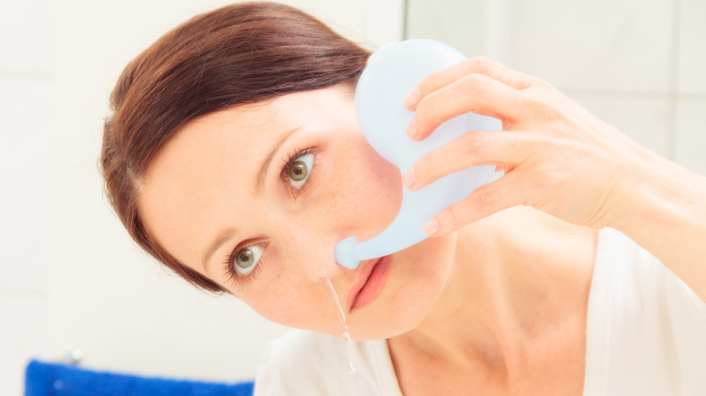 woman with neti pot