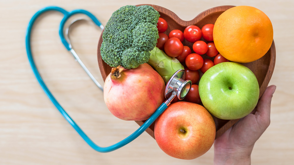 Fruits and vegetables in heart-shaped dish 