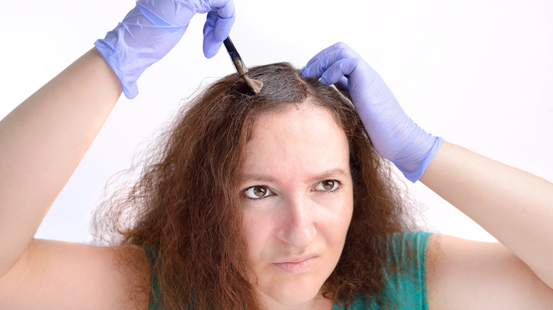 woman coloring her own hair 