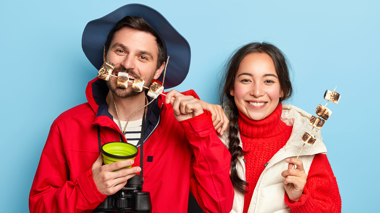 couple eating toasted marshmallows