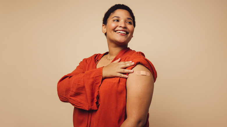 woman with bandage over arm