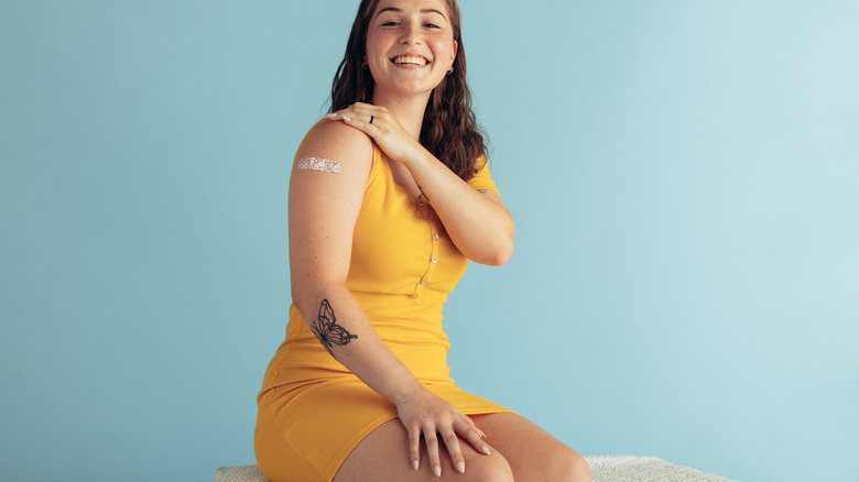 woman with bandage over arm