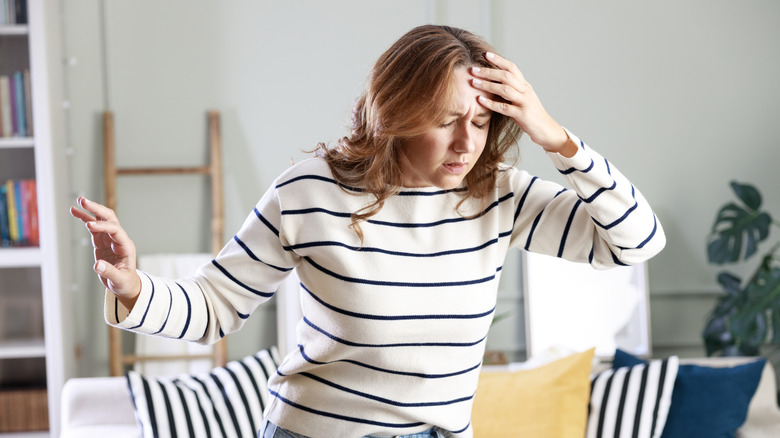 woman with low blood sugar feeling dizzy