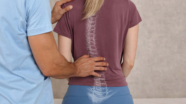 woman getting a scoliosis exam