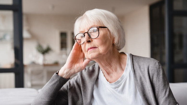 Older woman looking into distance