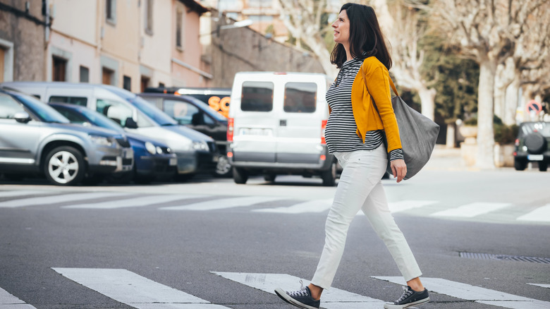 a pregnant woman walking during a lunch break