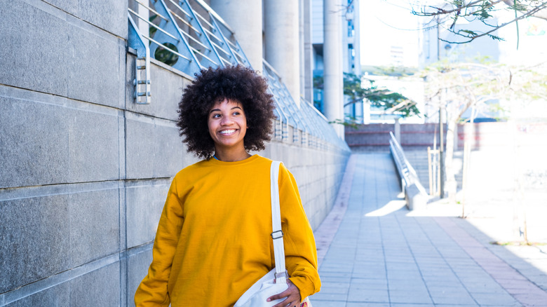 a young woman walking after work