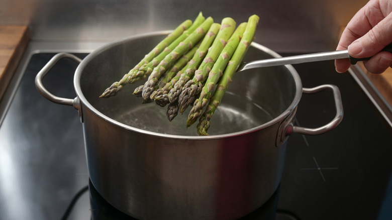 green asparagus in boiling water