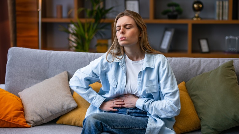 person holding their stomach