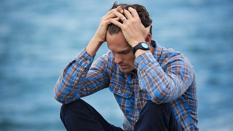 Man stressed out by water
