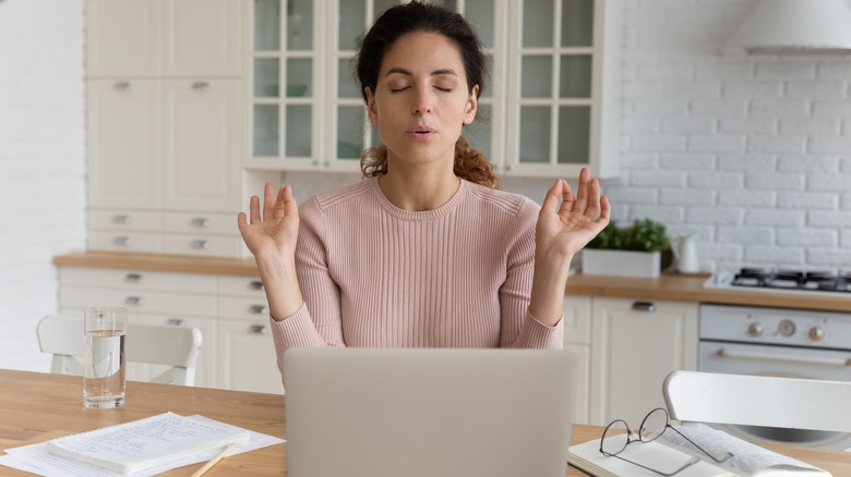 Woman stressed relaxing techniques computer