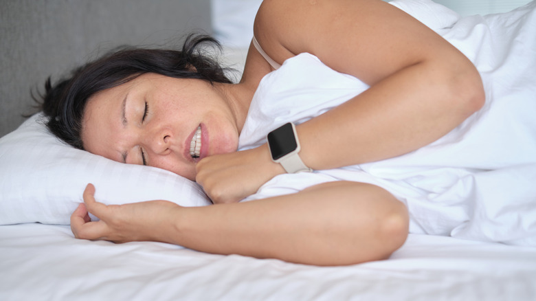 A woman sleeping and grinding her teeth
