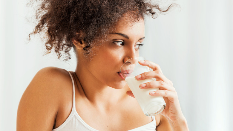 Woman drinking glass of milk