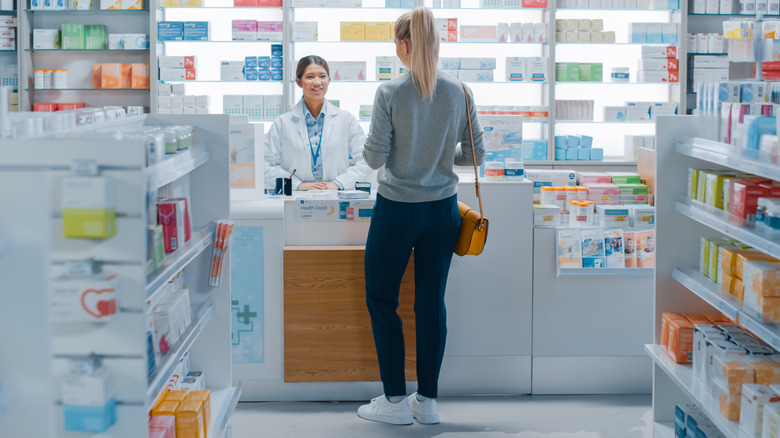 Woman talking to pharmacist