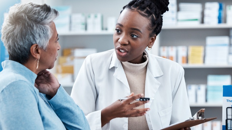 Medical professional speaking to patient