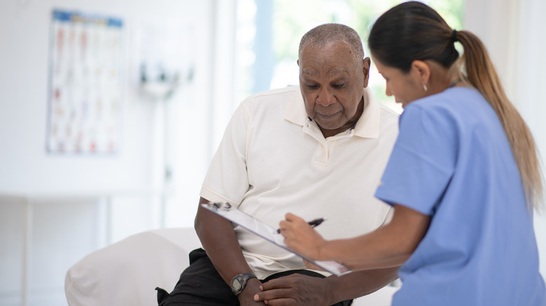 Doctor showing patient their chart