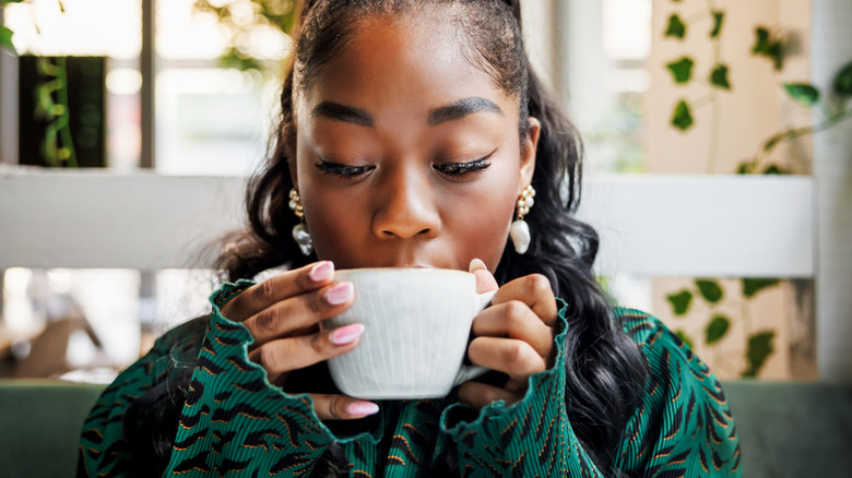 young woman drinking coffee