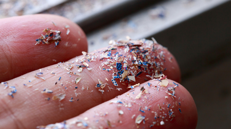 Microplastics on fingers