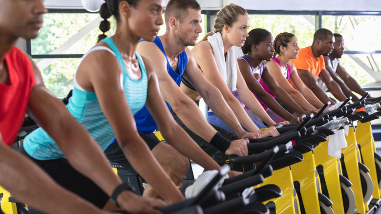 Side view of fit people exercising