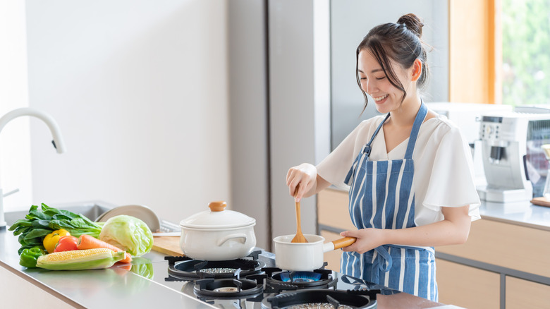 Woman cooking vegetables