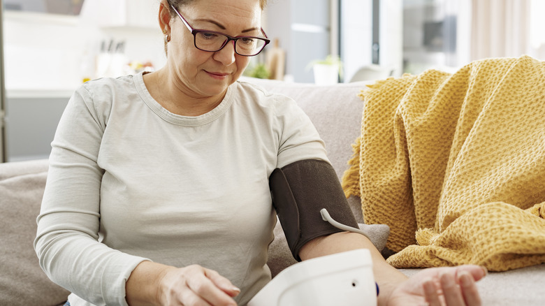 Woman checking blood pressure