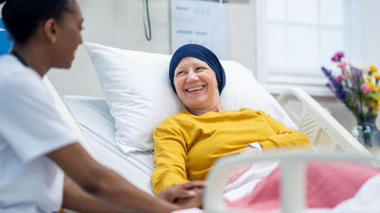 cancer patient smiling at a doctor