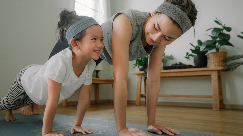 woman working out with her daughter