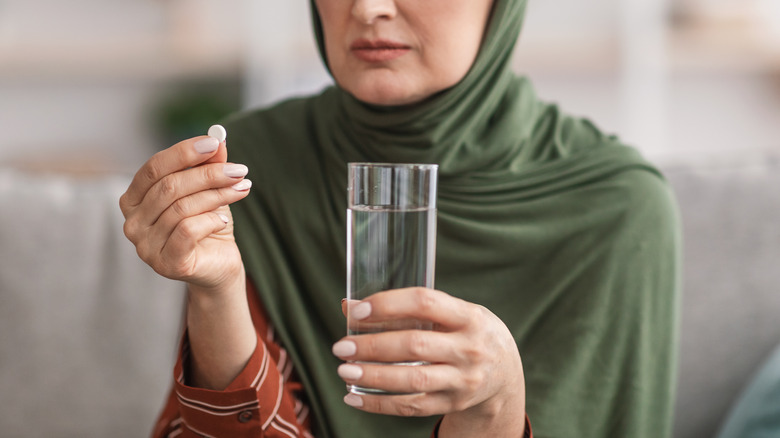 woman taking vitamin