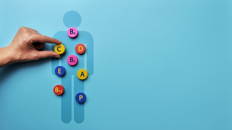 silhouette of man with vitamins on top