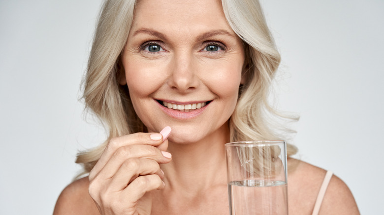 woman taking vitamins