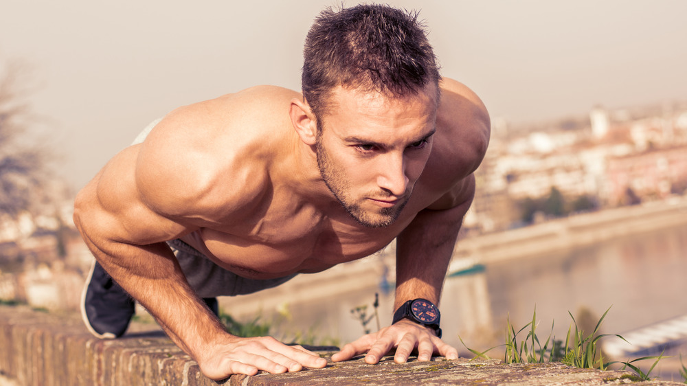 man performing pushup with wrists inward