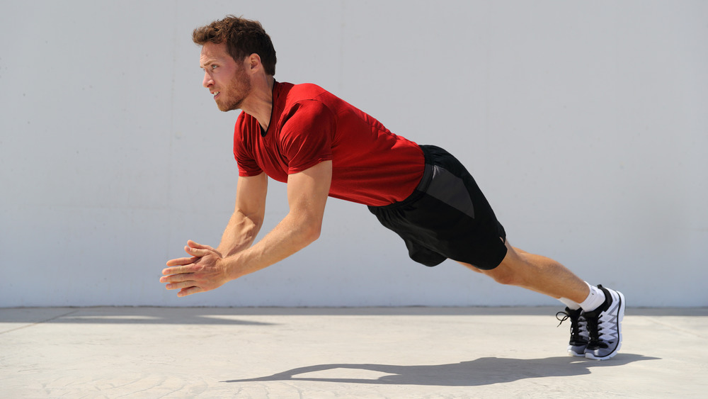 man clapping pushups