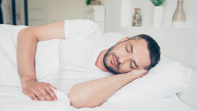 Man asleep in bed