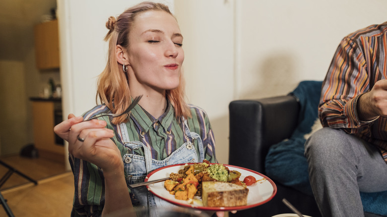 Woman eating vegetarian food