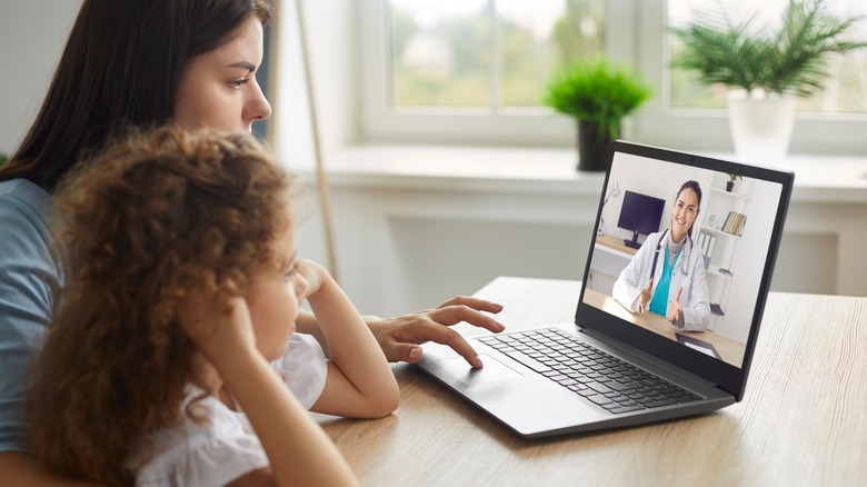 Mother and child during telemedicine visit