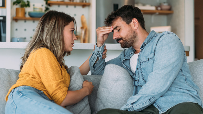 wife comforting upset husband