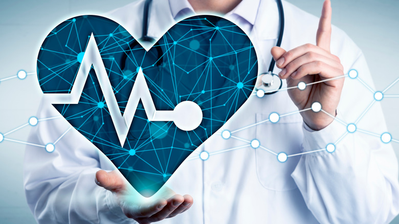 Cardiovascular health representation on doctor's hand