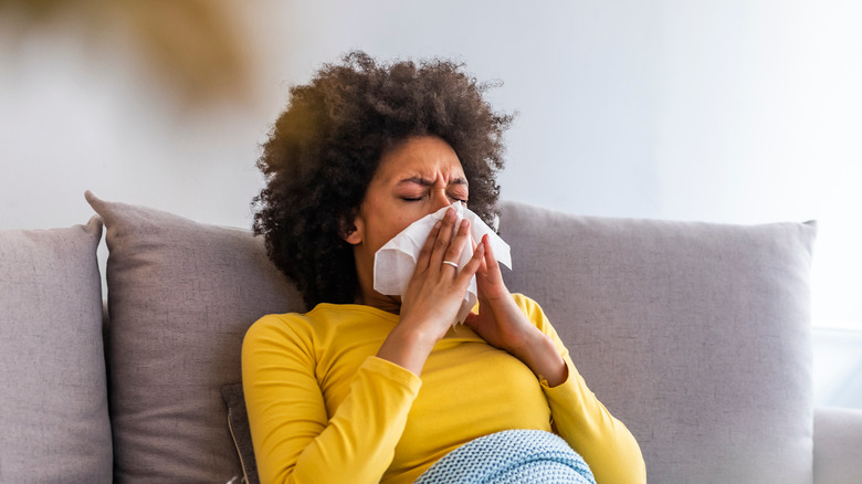 woman sneezing