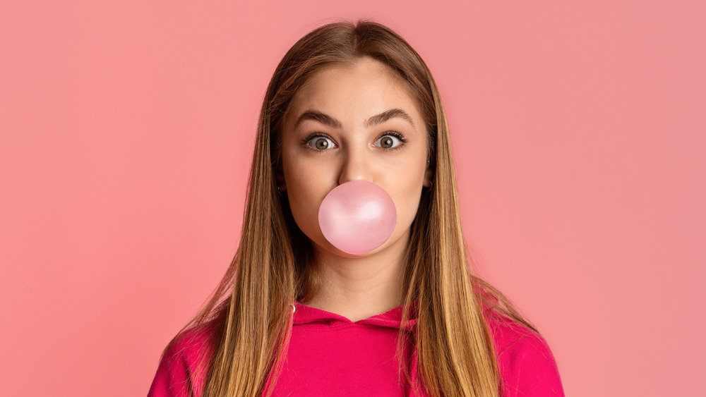 Woman chewing bubble gum 