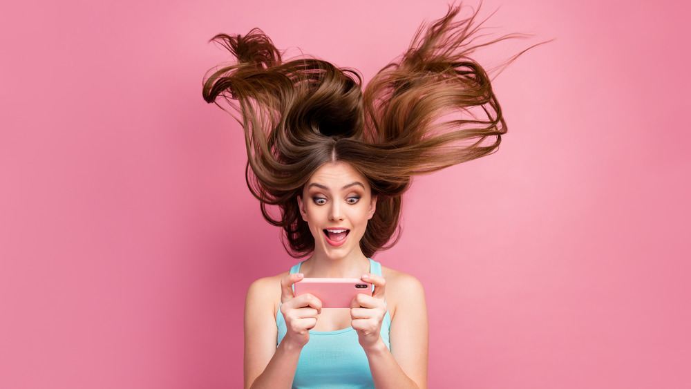 Woman with hair blowing wildly