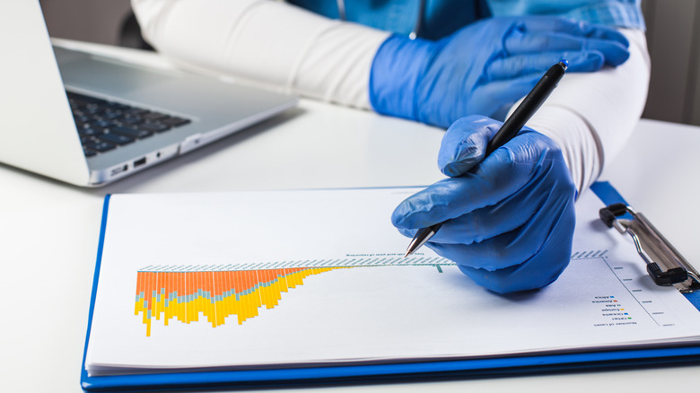 Medical researcher compiling health data