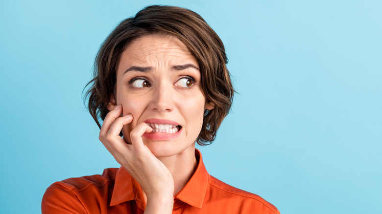 Woman making nervous face