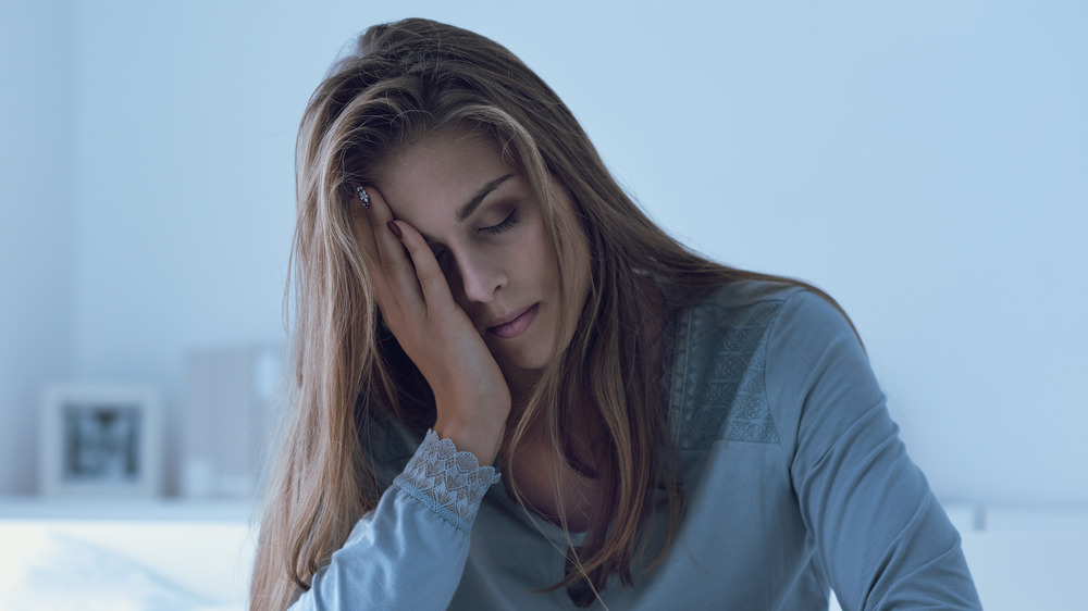 tired woman in bed