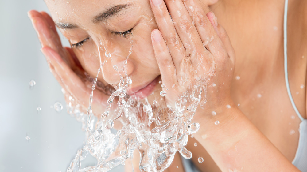 woman washing face