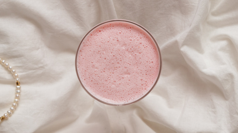 strawberry milkshake placed on cloth